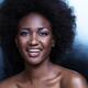 Beautiful smiling black african american woman face portrait... (thumbnail)