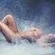 Beautiful naked woman lying in smoke... (thumbnail)