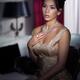 Artistic portrait of young woman sitting in dark bedroom... (thumbnail)
