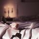 Handcuffs and a rose on bed Romantic suggestive still life... (thumbnail)