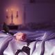 Handcuffs and a rose on bed. Suggestive intimate scene still life.... (thumbnail)