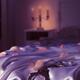 Handcuffs and rose petals on bed... (thumbnail)