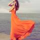 Beautiful Woman in Orange dress on Sea Shore... (thumbnail)