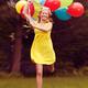 Happy young woman running with balloons... (thumbnail)