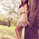 Young Smiling Asian Woman in a Park... (thumbnail)