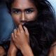 Emotional beauty portrait of a woman covering her faice with hair... (thumbnail)