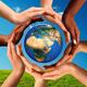 Multiracial Hands Together Around World Globe... (thumbnail)