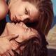 Faces of young couple kissing at the beach... (thumbnail)