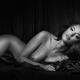 Beautiful Woman Lying Naked in Bed Black and white portrait... (thumbnail)