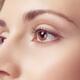 Young woman face closeup of brown eyes... (thumbnail)