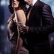 Sensual young couple in front of a window romantic portrait of a man s... (thumbnail)