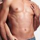 Woman standing behind a man with sexy muscular bare torso... (thumbnail)