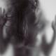 Young woman trapped behind glass... (thumbnail)