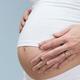 Pregnant Woman with Hands On Her Belly... (thumbnail)