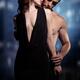 Sensual couple portrait of man and woman embracing at a window... (thumbnail)