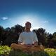 Man meditating in the nature during sunrise... (thumbnail)