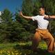 Shaolin school instructor Dao Shi practicing sunrise Qi Gong... (thumbnail)