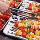 Vegetarian skewers cooking on fire... (thumbnail)