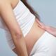 Pregnant woman with back pain getting massage... (thumbnail)