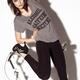 Girl in funny t-shirt posing with exercise bike... (thumbnail)