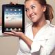 Smiling girl looking at iPad in her hands... (thumbnail)