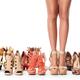 Woman legs surronded by many different shoes... (thumbnail)