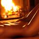 Nude shiny woman body in front of fireplace... (thumbnail)