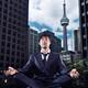 Businessman meditating in downtown Toronto... (thumbnail)
