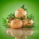 Potatoes on green background... (thumbnail)
