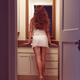Young sexy woman at a bathroom mirror... (thumbnail)