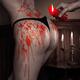 Melted red wax dripping from candle on sexy woman body... (thumbnail)