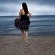 Woman running towards the shore... (thumbnail)