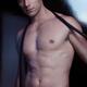 Sexy muscular man taking off necktie... (thumbnail)