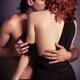 Sensual couple portrait of man kissing redhead woman... (thumbnail)