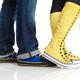 Closeup of man and woman wearing shoes... (thumbnail)