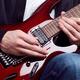 Person playing electric guitar... (thumbnail)