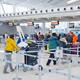 People checking in their baggage at airport... (thumbnail)