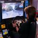 Man playing racing slot machine in Japan... (thumbnail)