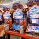 People playing slot machines at arcade in Japan... (thumbnail)