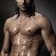 Portrait of man with wet bare torso standing under shower... (thumbnail)