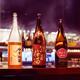 Japanese sake bottles on a bar counter... (thumbnail)