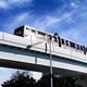 Yurikamome line train on elevated railway going through Odaiba Tokyo... (thumbnail)