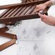 Person assembling IKEA furniture parts... (thumbnail)