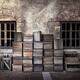 Wine bottles and crates outside of old house... (thumbnail)