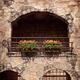 Balcony with flowers of old rustic house... (thumbnail)