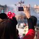 Woman recording a show with her iPhone at Tokyo Disneysea... (thumbnail)