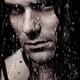 Dramatic portrait of young man wet face with long hair... (thumbnail)