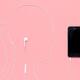 Woman silhouette with headphones plugged into iPhone... (thumbnail)