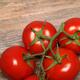 Tomatoes on wooden background... (thumbnail)