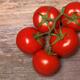 Vine tomatoes on wood... (thumbnail)